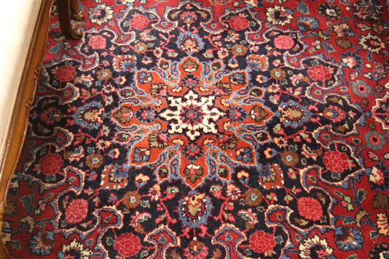 A Burgundy ground carpet 300 x 255cm